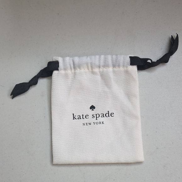 kate spade Handbags - Kate Spade Cream Pouch with Black Ties